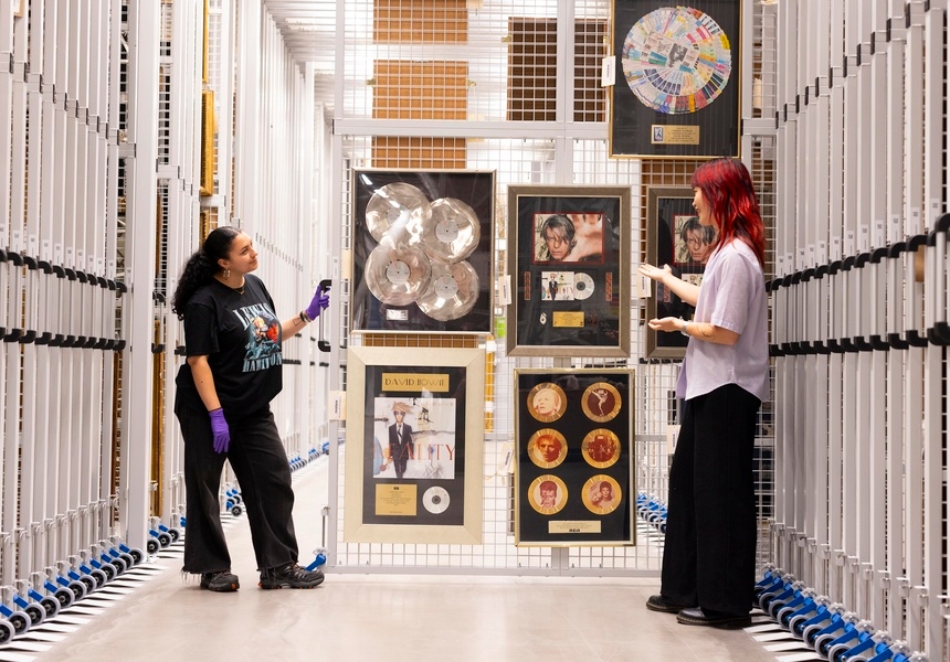 A visitor sees some of David Bowie’s awards in storage, at their Order an Object appointment at V&A East Storehouse