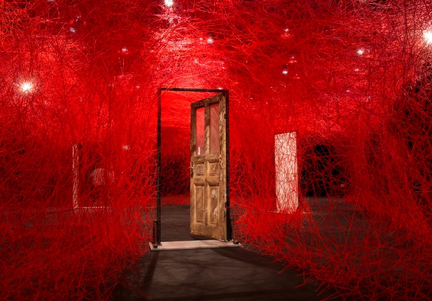 Chiharu Shiota, The Locked Room, 2016. Installation at KAAT Kanagawa Arts Theatre, Yokohama, Japan. © DACS, London, 2025 and Chiharu Shiota.